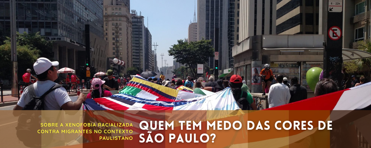Na imagem, consta algumas pessoas na Marcha dos Imigrantes e Refugiados, ano de 2019.